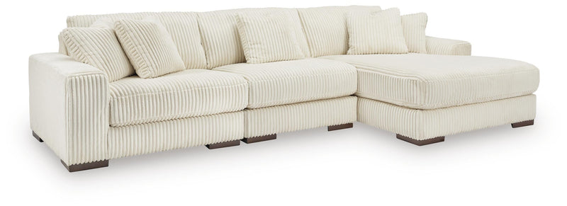 Ashley Furniture Lindyn living room set with sofa, loveseat, and matching coffee table in a modern design.