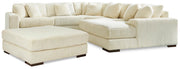Ashley Furniture Lindyn living room set featuring a sofa and armchair with neutral fabric upholstery and modern design.