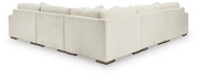 Ashley Furniture Lindyn living room set with sofa and armchair, featuring plush cushions and modern design in a cozy living space.