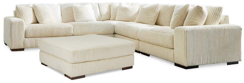 Ashley Furniture Lindyn living room set featuring a plush sofa and matching armchair in a modern design.