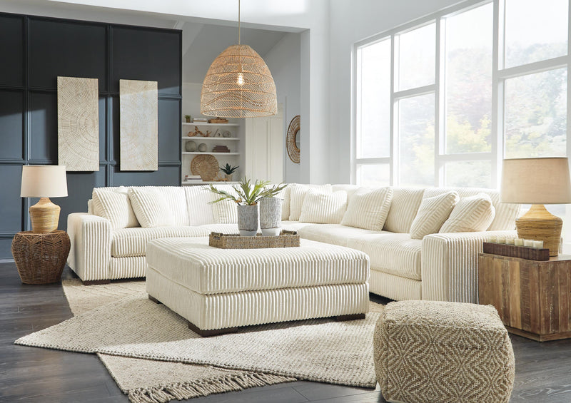 Ashley Furniture Lindyn living room set with sofa and loveseat, featuring neutral fabric upholstery and contemporary design.