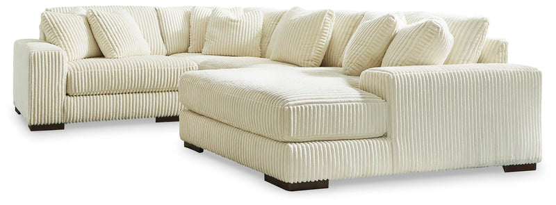Ashley Furniture Lindyn sectional with chaise, featuring plush fabric, modern design, and multiple seating areas in a stylish living room setup.