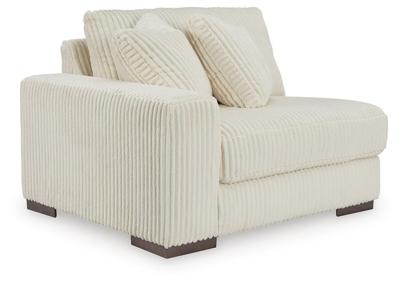 Ashley Furniture Lindyn sectional with chaise, angled view showing plush fabric upholstery and spacious seating.