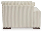 Ashley Furniture Lindyn sectional with chaise, featuring plush cushions and modern design, shown from the back view.