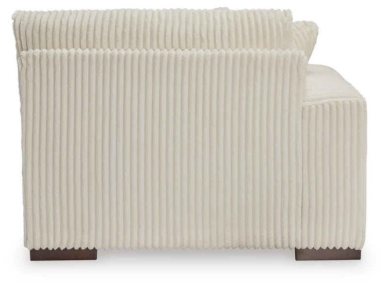 Ashley Furniture Lindyn sectional with chaise, featuring plush cushions and modern design, shown from the back view.