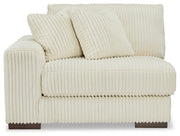 Ashley Furniture Lindyn sectional with chaise, view of the beige fabric sofa and chaise lounge from the front.