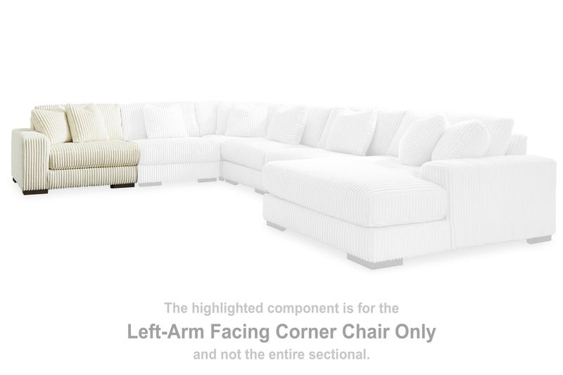 Ashley Furniture Lindyn sectional with chaise featuring plush fabric and modern design, shown in a living room setting.