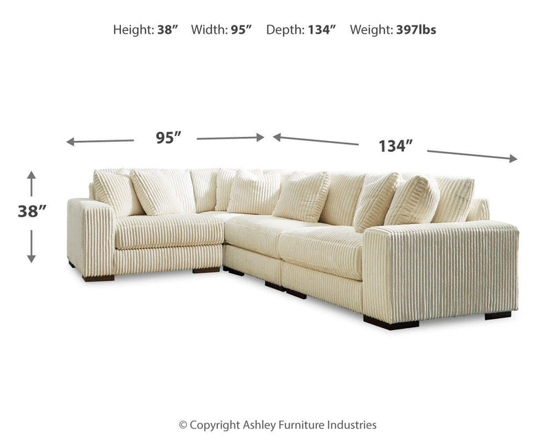 Ashley Furniture Lindyn living room set featuring a sofa and loveseat with neutral fabric upholstery and modern design.