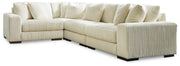 Ashley Furniture Lindyn living room set with a sofa and loveseat featuring neutral fabric upholstery and modern design.
