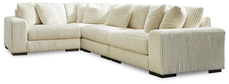 Ashley Furniture Lindyn living room set with a sofa and loveseat featuring neutral fabric upholstery and modern design.