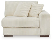 Ashley Furniture Lindyn sectional with chaise, showcasing plush fabric and modern design from a head-on view.