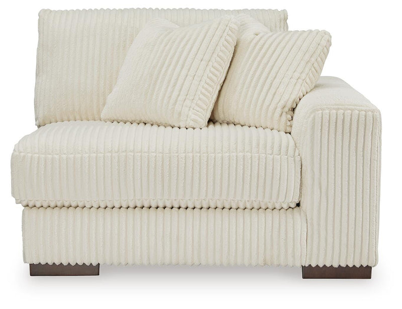 Ashley Furniture Lindyn sectional with chaise, showcasing plush fabric and modern design from a head-on view.