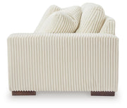 Ashley Furniture Lindyn sectional with chaise, showing a modern fabric sofa with a side chaise and plush cushions.