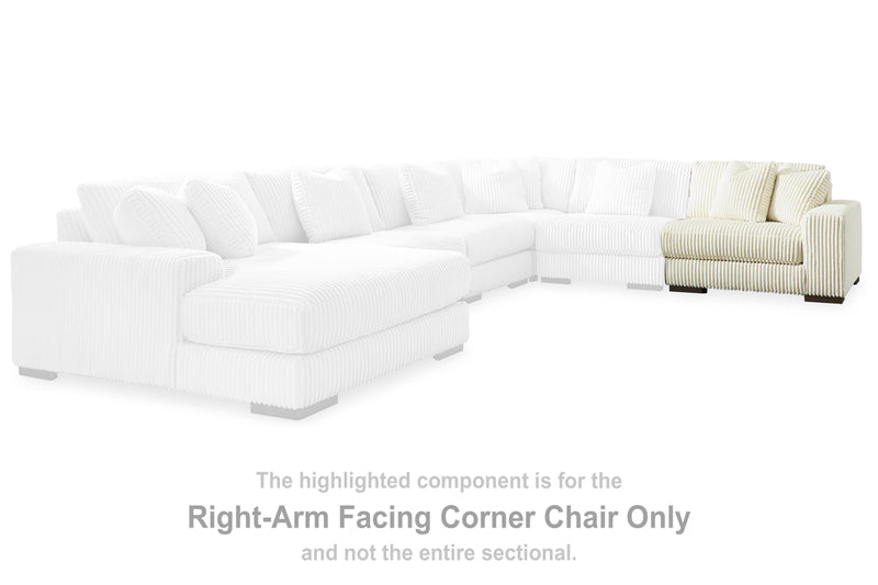 Ashley Furniture Lindyn sectional with chaise showing plush fabric, modern design, and spacious seating in a neutral color.