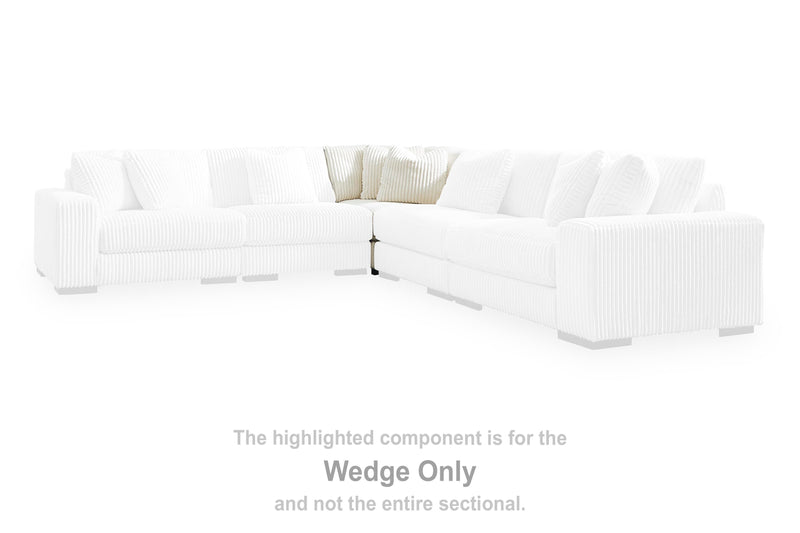 Ashley Furniture Lindyn sectional with chaise, dark gray fabric sofa with plush cushions and a spacious design.