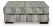 Ashley Furniture Lindyn living room set featuring a sofa and loveseat with neutral upholstery and stylish cushions.