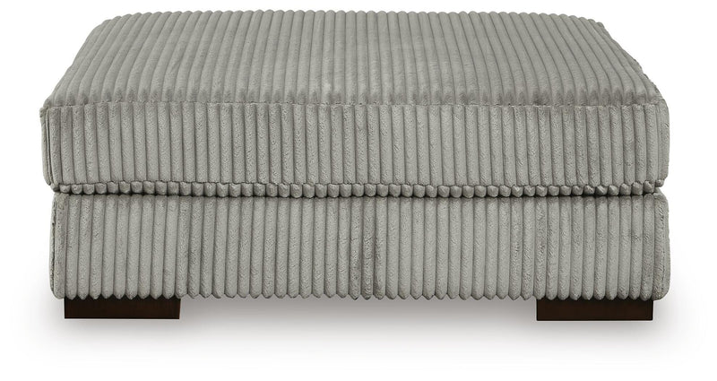 Ashley Furniture Lindyn living room set featuring a sofa and loveseat with neutral upholstery and stylish cushions.