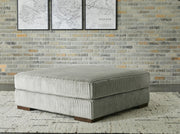 Ashley Furniture Lindyn living room set featuring a sofa and armchair with neutral upholstery and modern design.