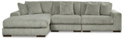 Ashley Furniture Lindyn sectional with chaise in neutral fabric, featuring plush cushions and a modern design.