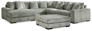 Ashley Furniture Lindyn living room set includes a sofa, loveseat, and coffee table with neutral fabric upholstery.