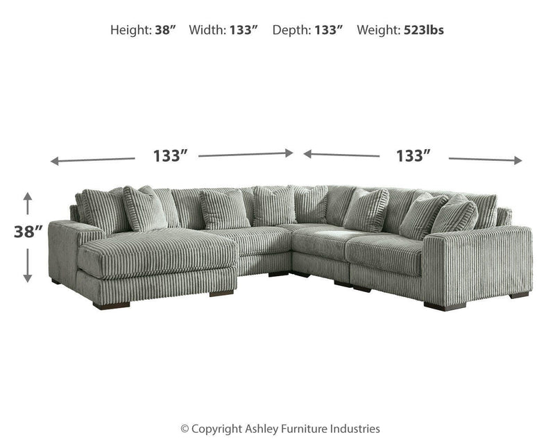 Ashley Furniture Lindyn living room set with a sofa and armchair featuring neutral upholstery and modern design.
