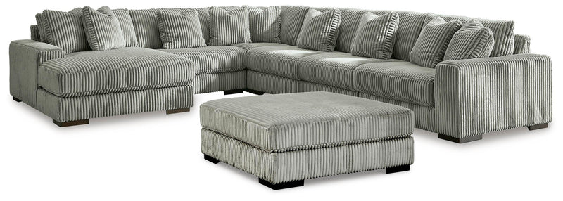 Ashley Furniture Lindyn living room set with sofa, loveseat, and armchair in neutral fabric and modern design.
