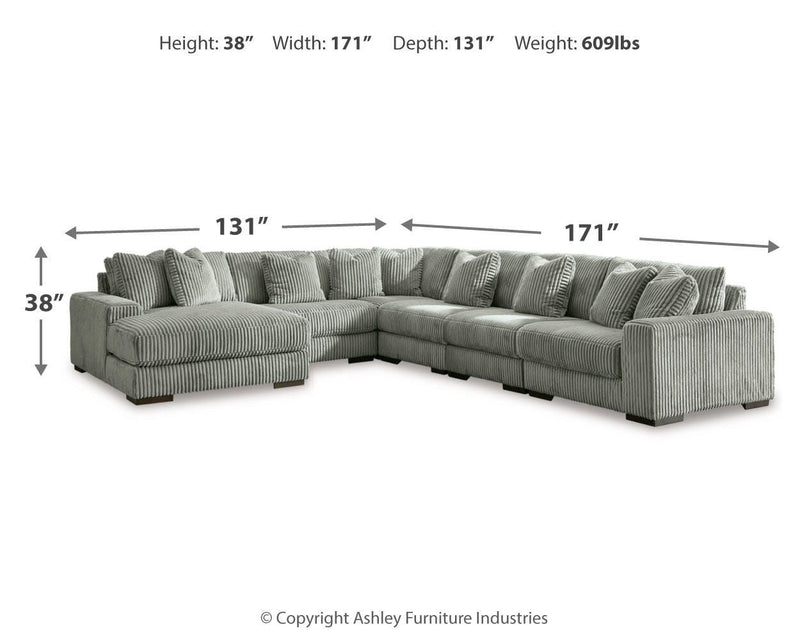 Ashley Furniture Lindyn living room set with sofa and armchair in a modern, stylish design, featuring neutral upholstery.