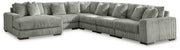 Ashley Furniture Lindyn sectional with chaise, fabric upholstery, and plush cushions in a modern living room setting.