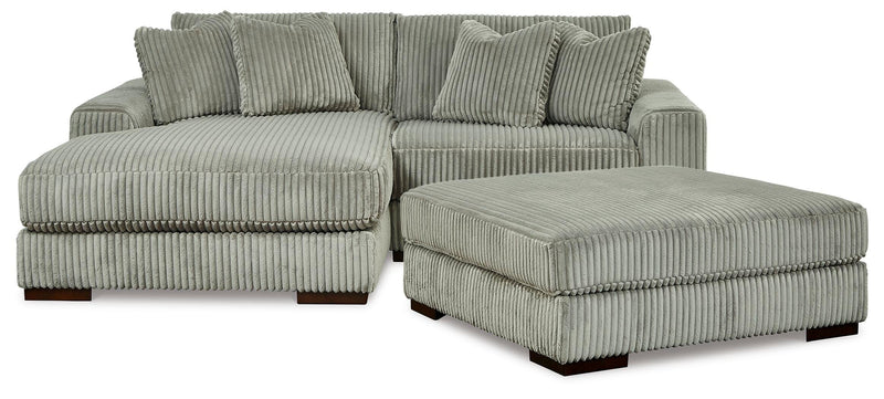 Ashley Furniture Lindyn living room set featuring a sofa and loveseat with neutral upholstery and modern design.