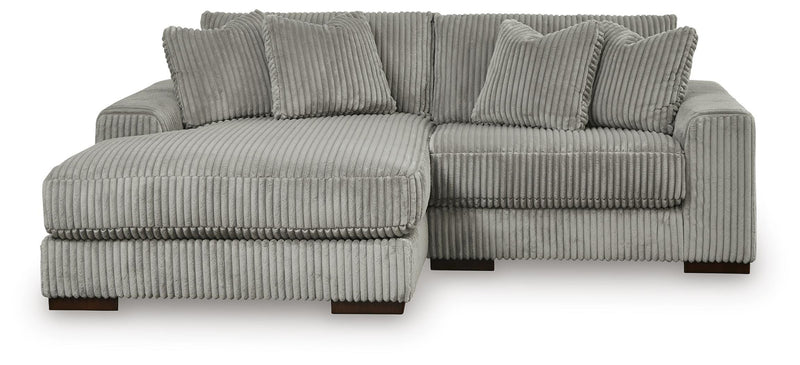 Ashley Furniture Lindyn living room set with a sofa and loveseat, featuring neutral fabric upholstery and modern design.