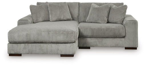 Ashley Furniture Lindyn sectional with chaise, showing a contemporary fabric sofa with plush cushions and a spacious design.