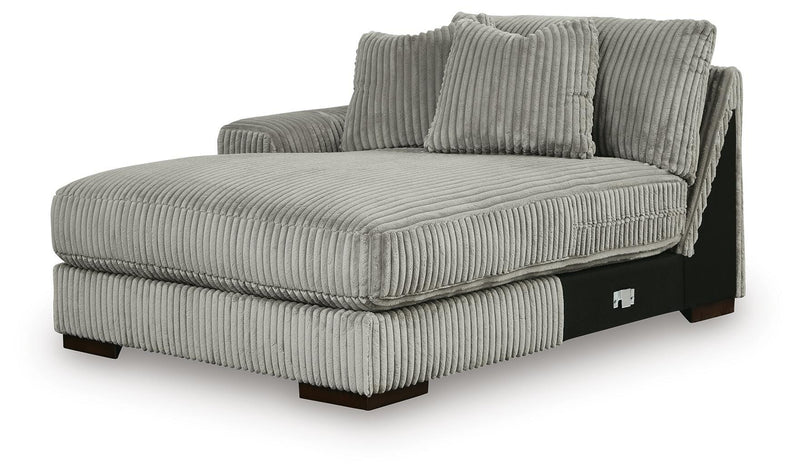 Ashley Furniture Lindyn sectional with double chaise, featuring plush fabric and modern design, shown from an angled side view