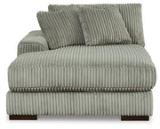 Ashley Furniture Lindyn sectional with double chaise, showing plush fabric and modern design in a cozy living room setting.
