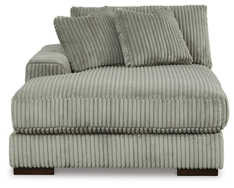 Ashley Furniture Lindyn sectional with double chaise, showing plush fabric and modern design in a cozy living room setting.