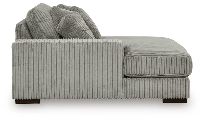 Ashley Furniture Lindyn sectional with double chaise, featuring plush cushions and modern design, shown in a stylish living room setting.