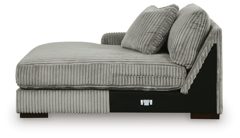 Ashley Furniture Lindyn sectional with double chaise, featuring plush upholstery and modern design in a spacious living room setting.