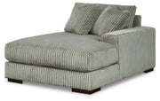 Ashley Furniture Lindyn sectional with double chaise, showing the angled view of the modern fabric sofa with multiple cushions.