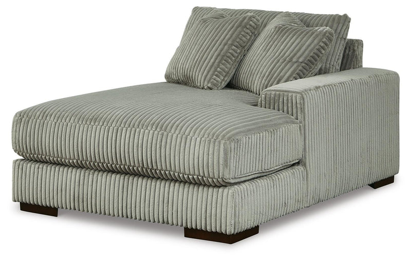 Ashley Furniture Lindyn sectional with chaise, showing a modern fabric sectional sofa with plush cushions and a spacious design.