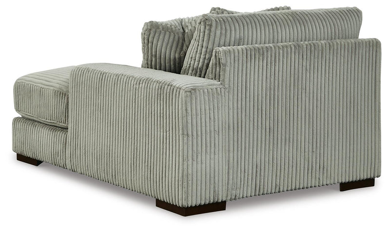 Ashley Furniture Lindyn sectional with double chaise, showing plush upholstery and modern design in a spacious living room setting.