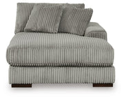 Ashley Furniture Lindyn sectional with double chaise, showing plush fabric upholstery and modern design from a head-on view.