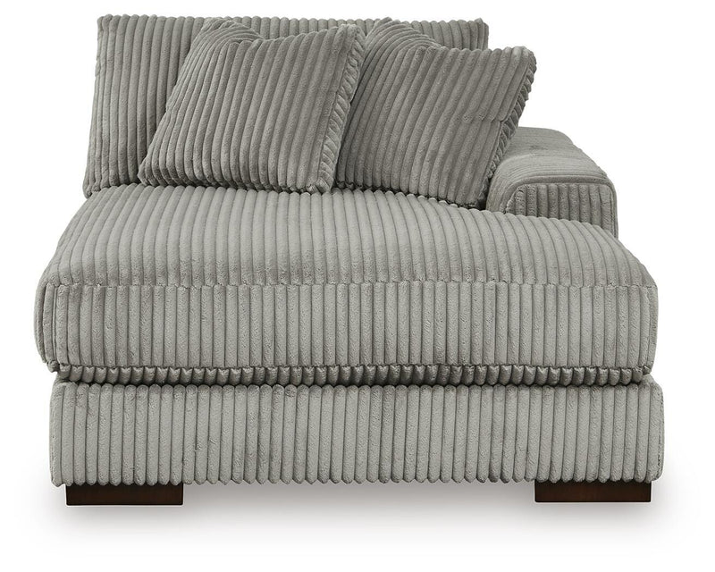 Ashley Furniture Lindyn sectional with chaise, showing a close-up of the beige fabric and modern design from the front.