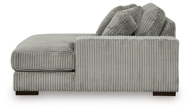 Ashley Furniture Lindyn sectional with chaise, featuring plush upholstery and modern design, shown in a spacious living room setting.