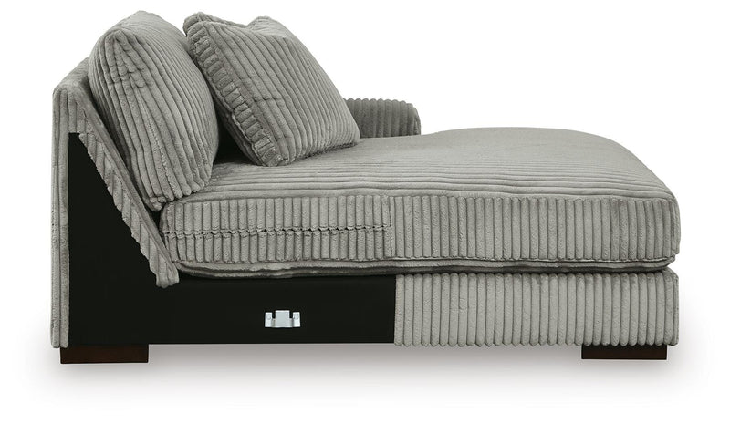 Ashley Furniture Lindyn sectional with double chaise, showing plush fabric upholstery and modern design in a spacious living room.