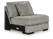 Ashley Furniture Lindyn sectional with double chaise, taupe fabric, featuring plush cushions and modern design in a living room setting.