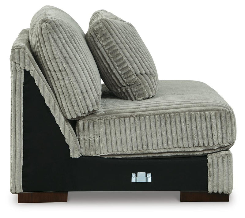 Ashley Furniture Lindyn sectional with double chaise, featuring plush cushions and modern design in a spacious living room setting.