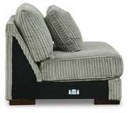 Ashley Furniture Lindyn sectional with chaise, showing a modern fabric sofa with a spacious chaise lounge in a living room setting.