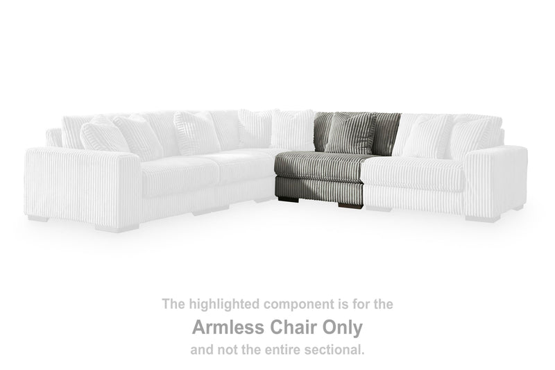 Ashley Furniture Lindyn sectional with chaise, showcasing modern fabric upholstery and spacious seating arrangement.