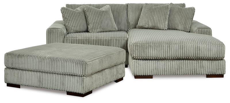 Ashley Furniture Lindyn living room set with sofa, loveseat, and armchair in a modern design with neutral upholstery.