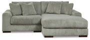 Ashley Furniture Lindyn sectional with chaise, featuring plush fabric upholstery and modern design, shown in a spacious living room.