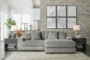 Ashley Furniture Lindyn sectional with chaise, showing plush fabric upholstery and modern design in a spacious living room setting.